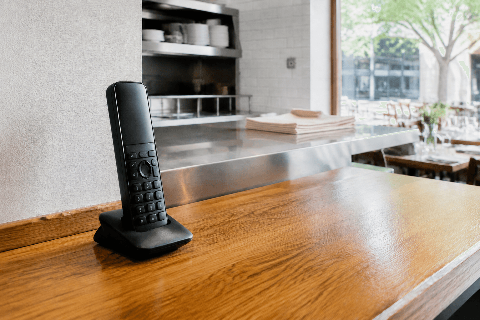 Illustrative restaurant telephone beside the kitchen pass